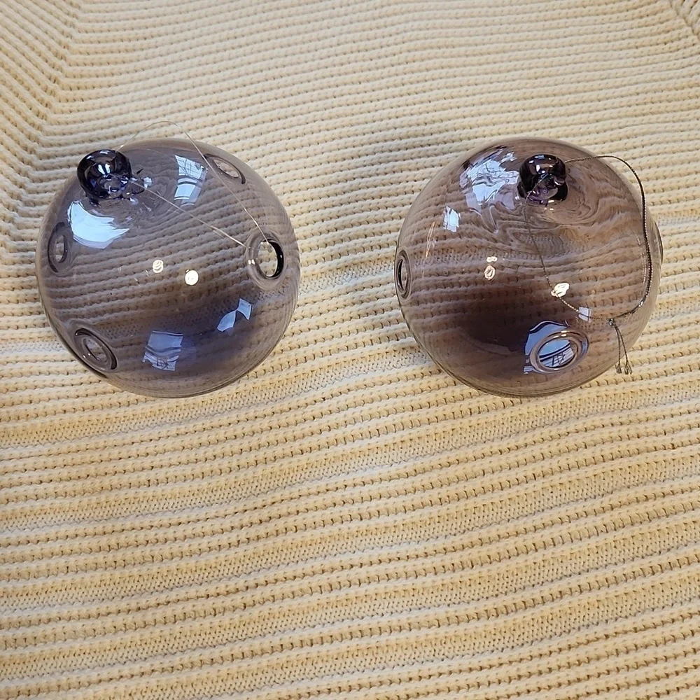 Pair of hand-made purple/pink glass Xmas ornaments with holes
